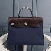 HM HERBAG ZIP 31 NAVY AND CHOCOLATE CANVAS