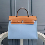 HM HERBAG ZIP 31 SKY AND BRONZE CANVAS