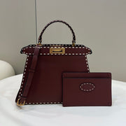 PEEKABOO ISEEU 33 IN SANGRIA RED GRAINED CALFSKIN GOLD HARDWARE