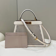PEEKABOO ISEEU 34 IN WHITE PERFORATED CALFSKIN GOLD HARDWARE