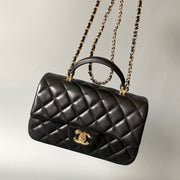 mini flap bag top handle 20cm black lambskin gold hardware