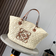 Medium anagram basket bag in iraca palm and calfskin