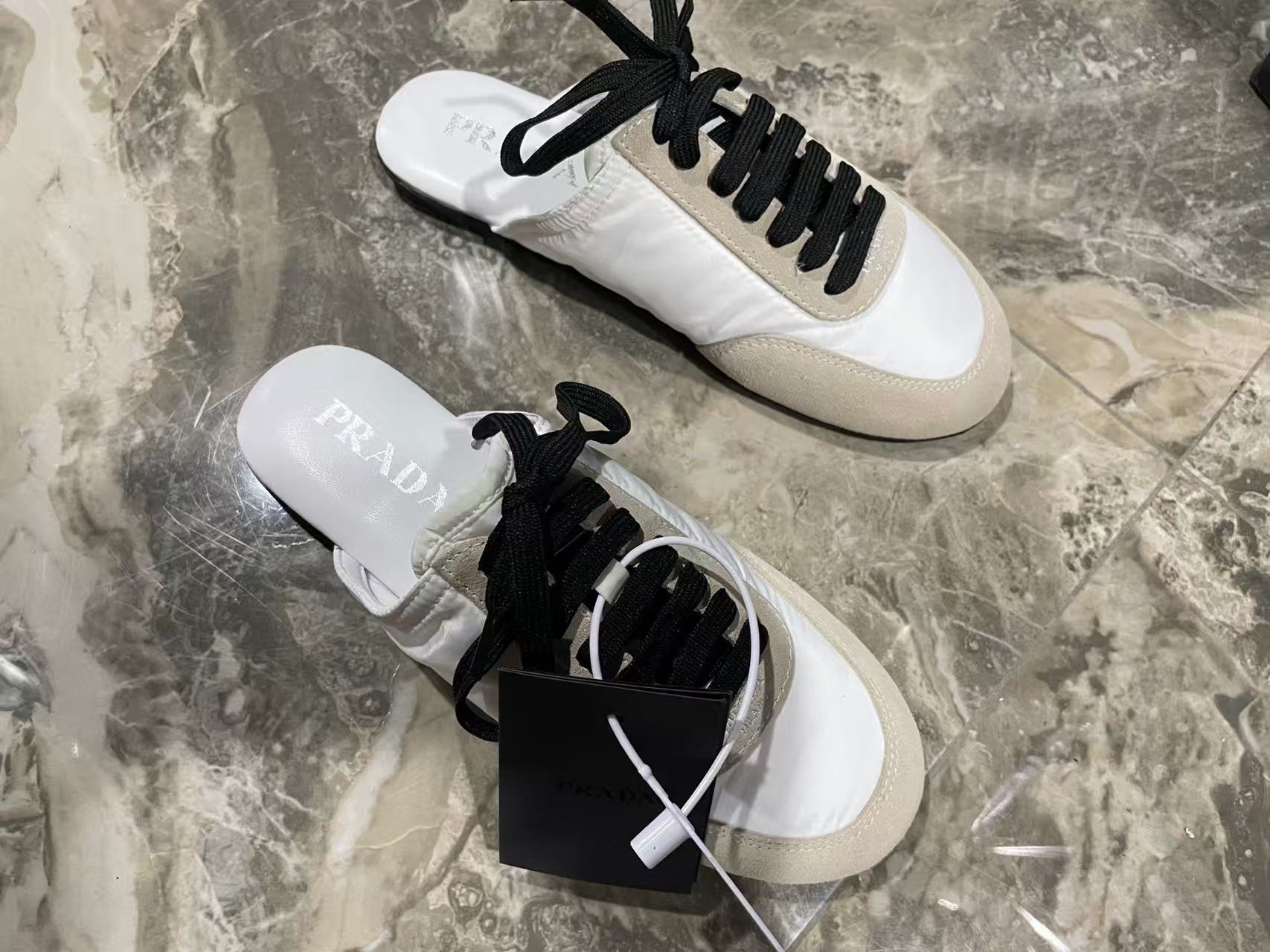 Prada 2026 Collapse Re-Nylon Mule White Black Suede
