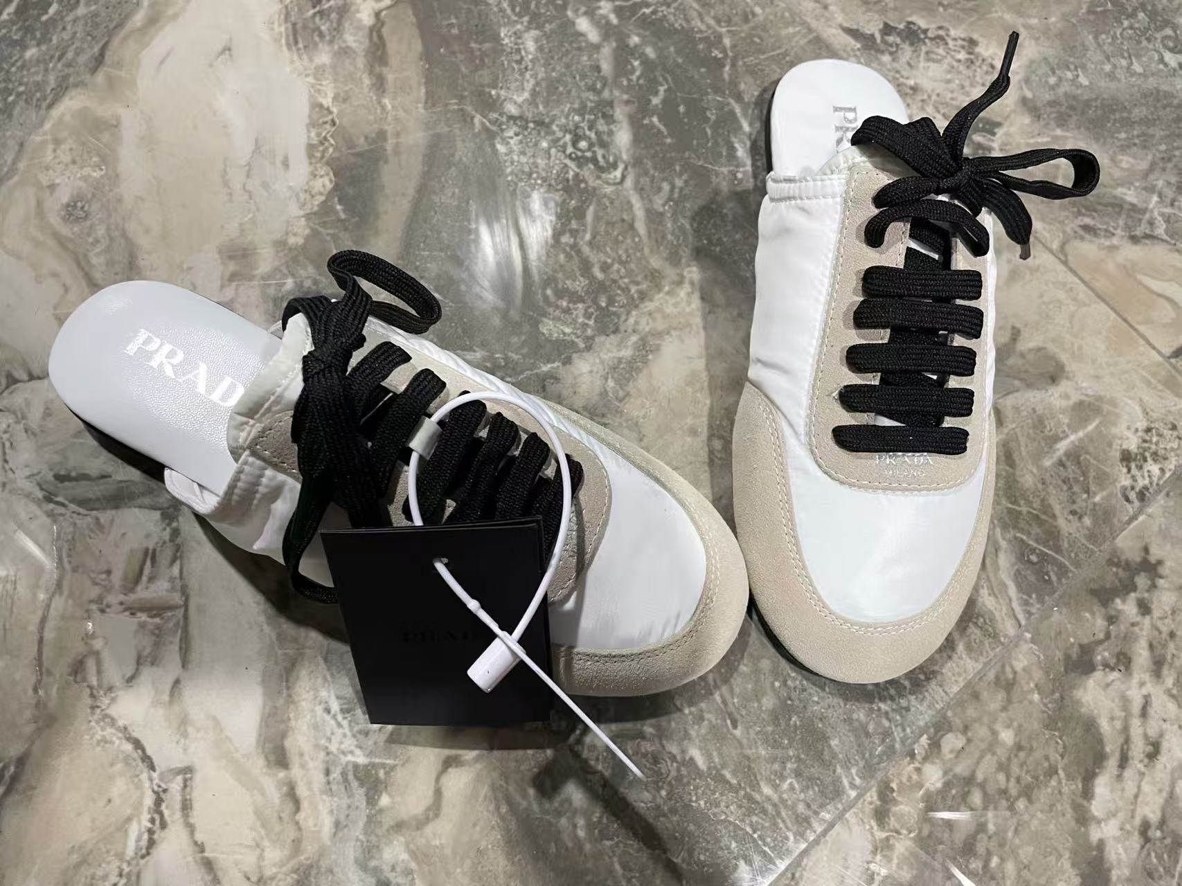 Prada 2026 Collapse Re-Nylon Mule White Black Suede
