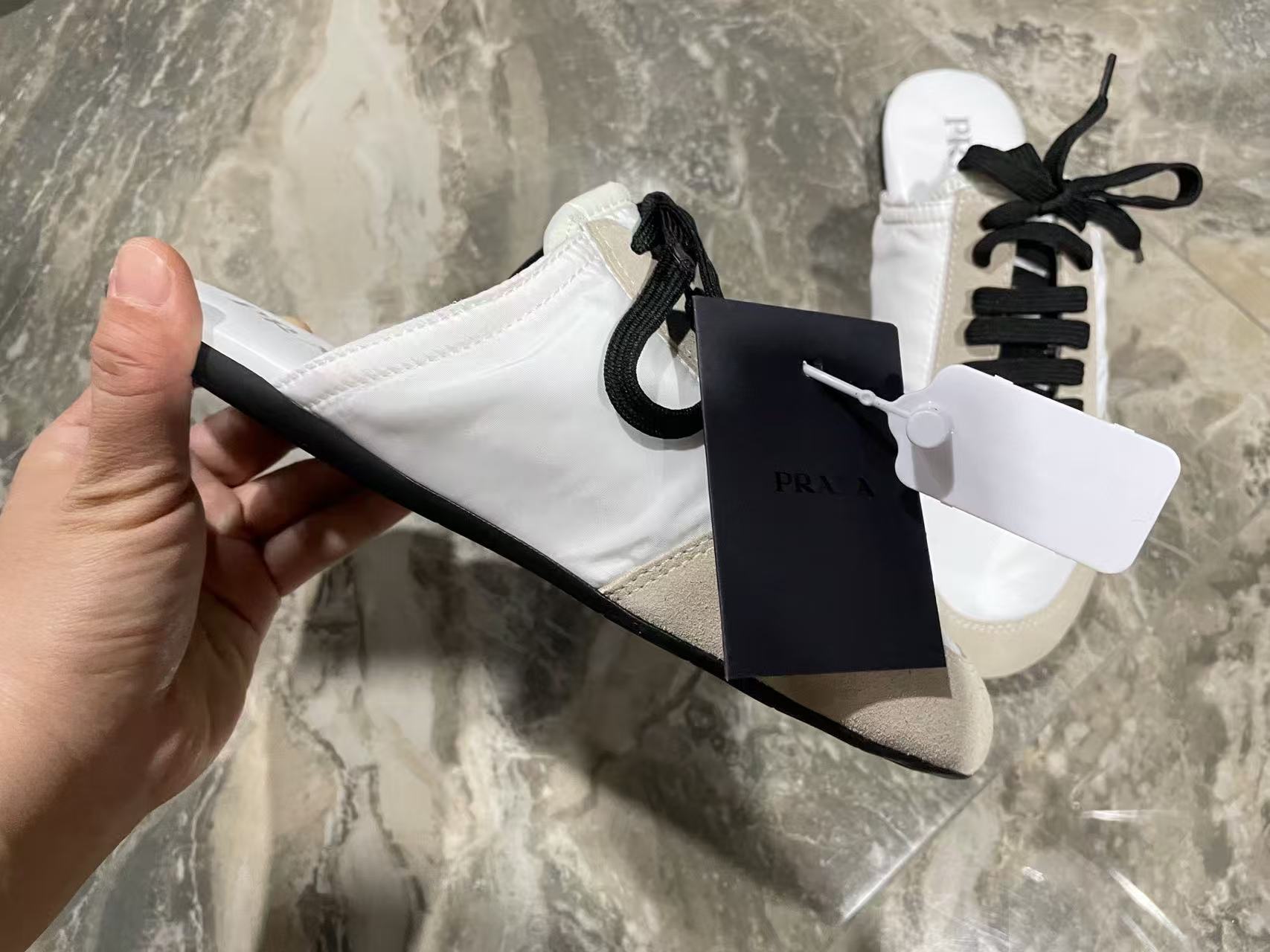 Prada 2026 Collapse Re-Nylon Mule White Black Suede