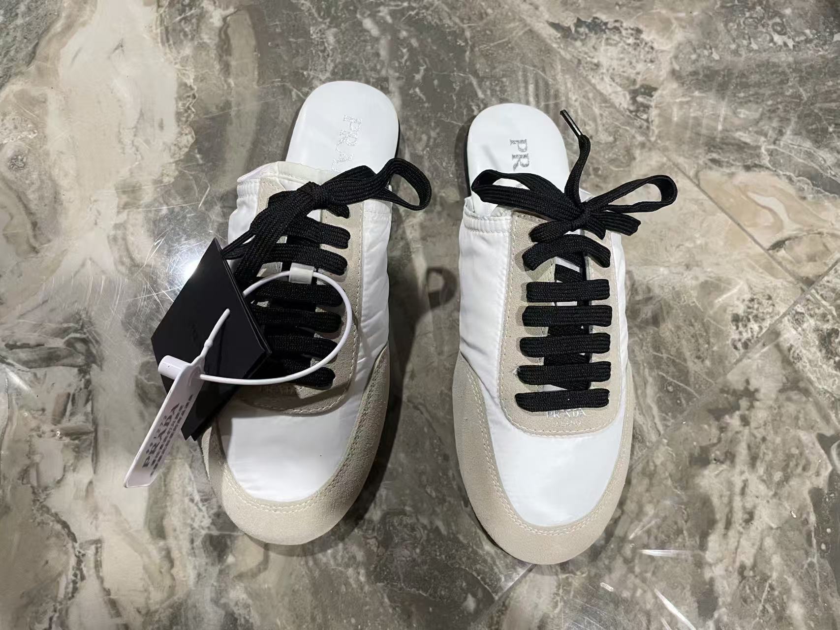 Prada 2026 Collapse Re-Nylon Mule White Black Suede