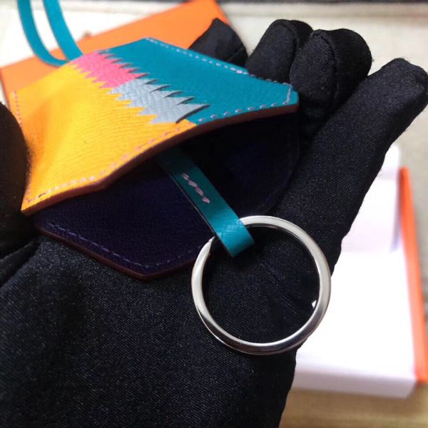 HM Clochette Cles Grand Tressage Charm In Yellow And Turquoise