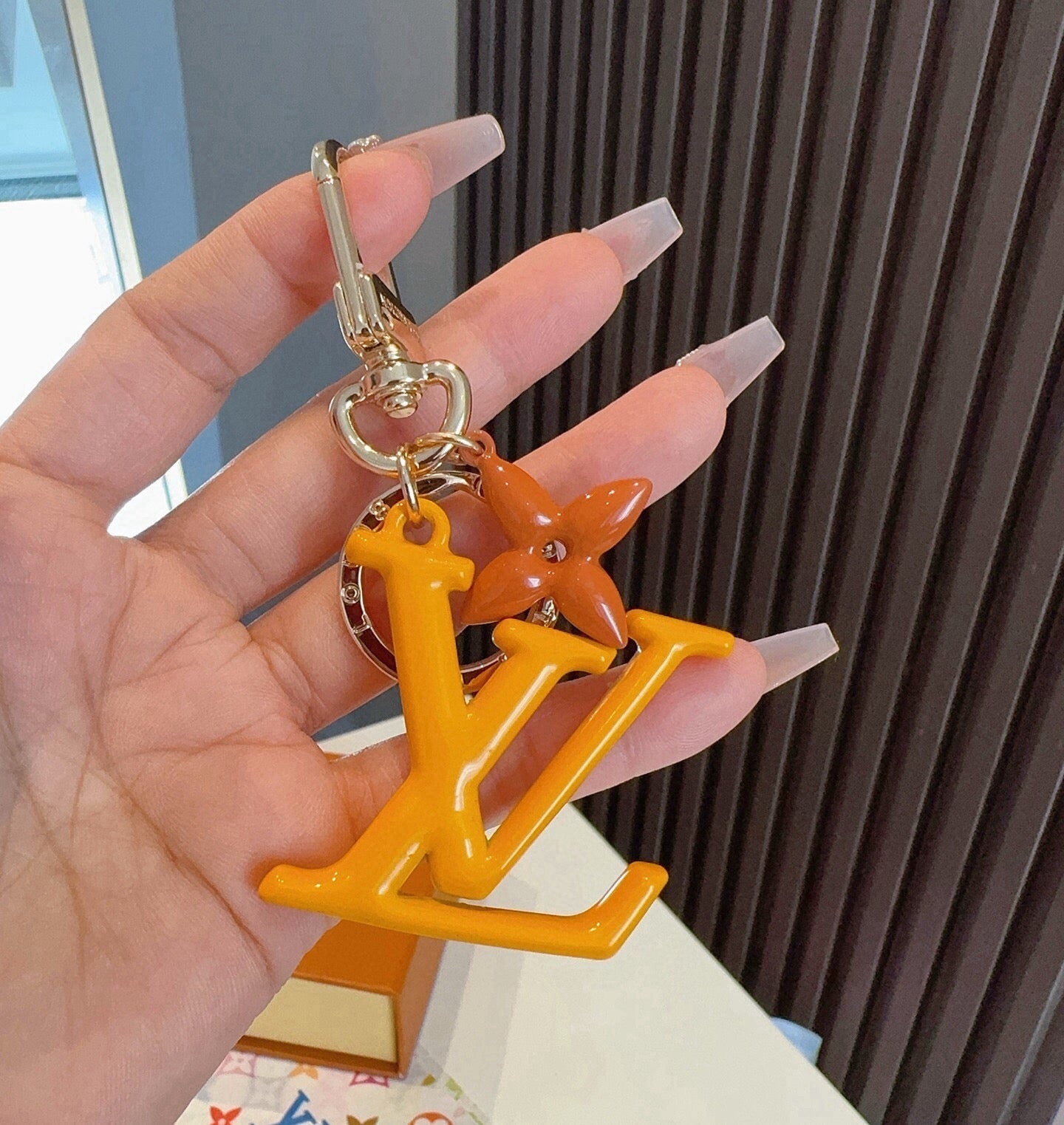 LV Logo Charm 415613