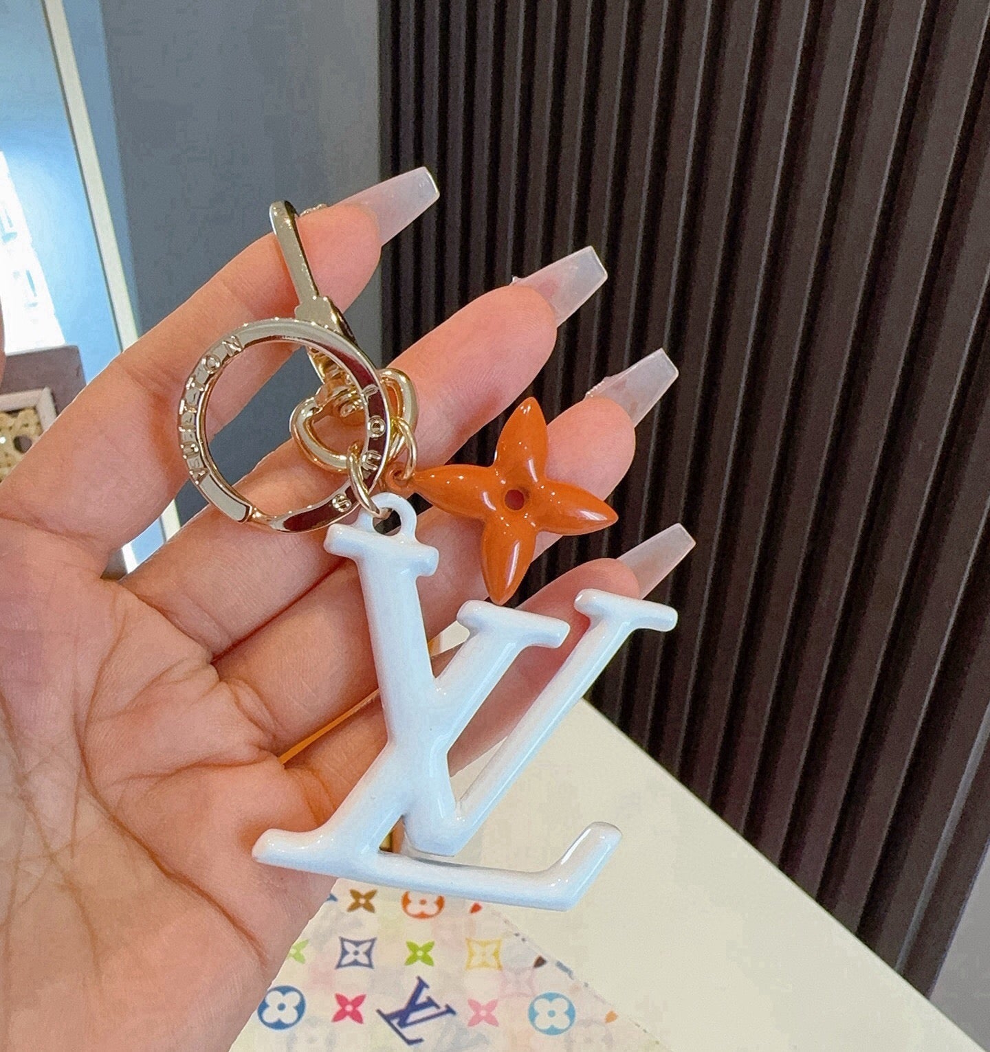 LV Logo Charm 415613