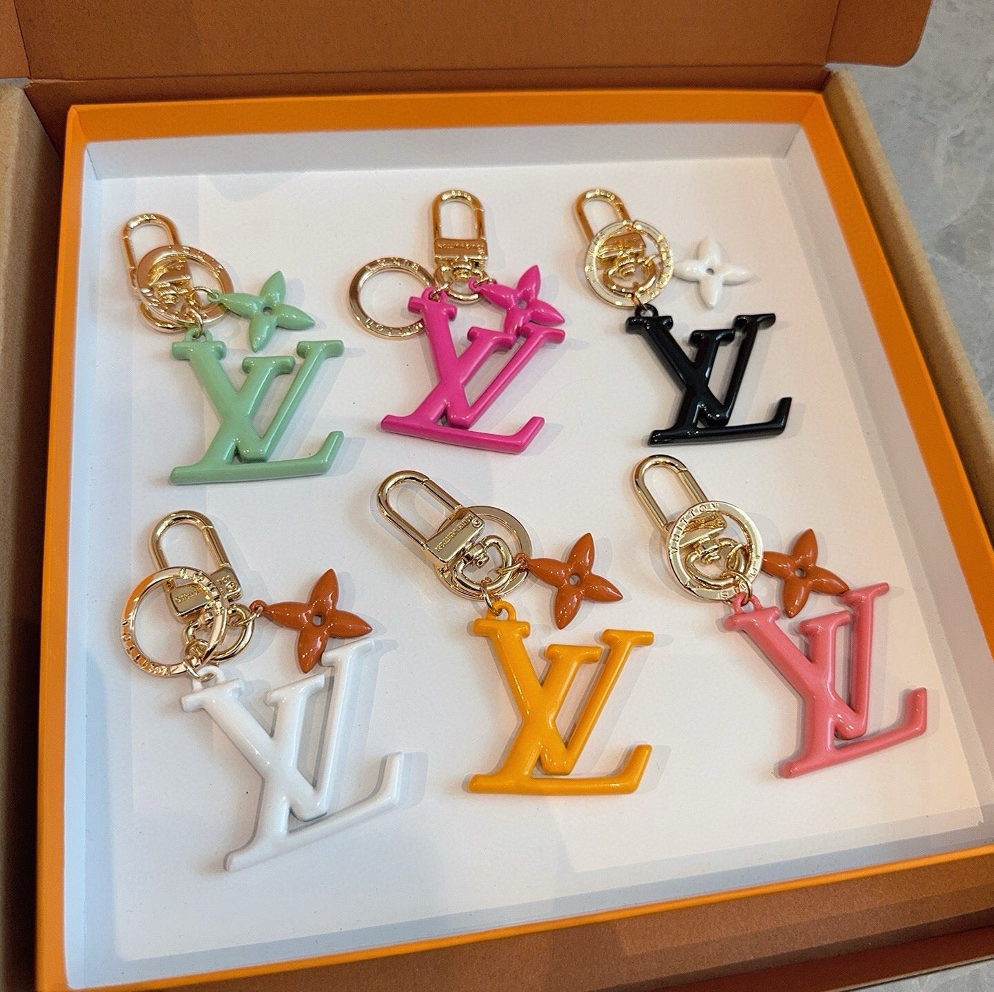 LV Logo Charm 415613