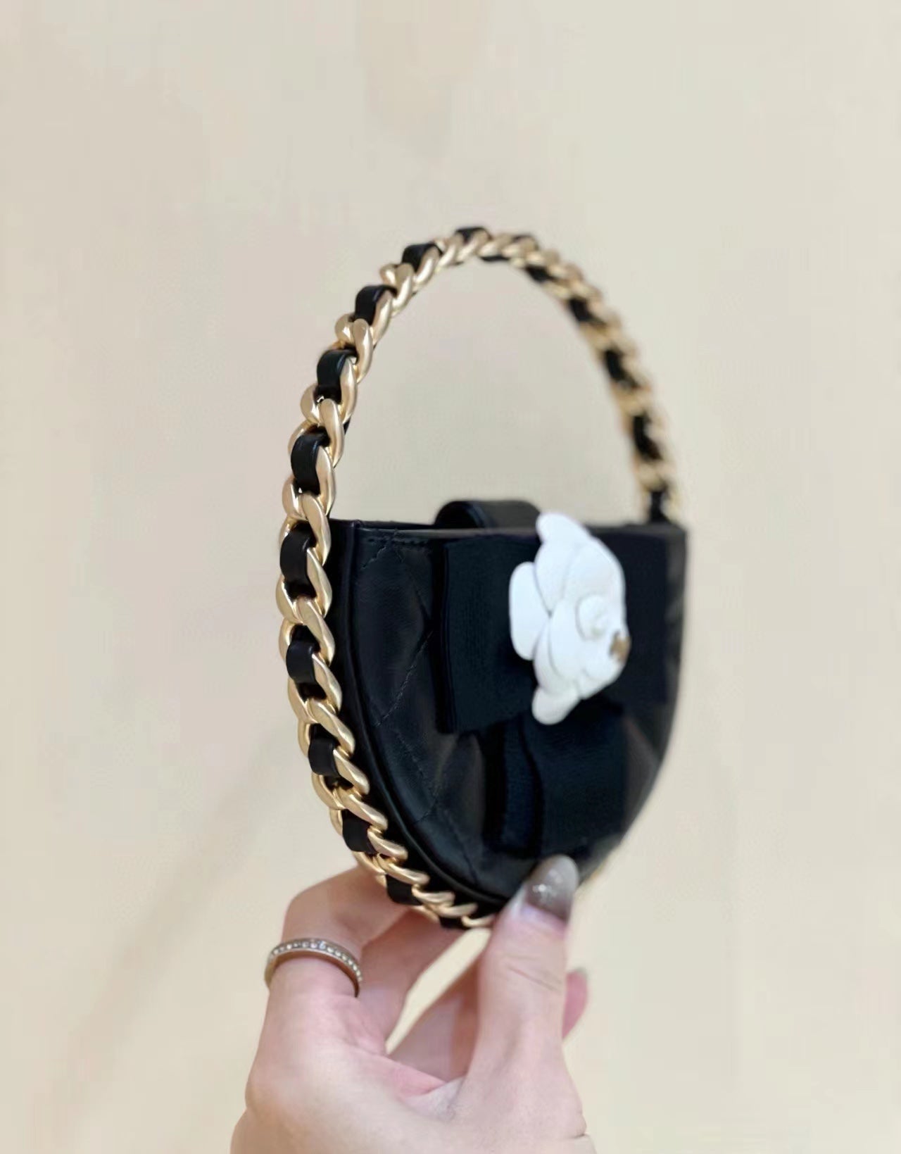 Chanel 2026 Quilted Round Camellia Mini Clutch 16cm Lambskin