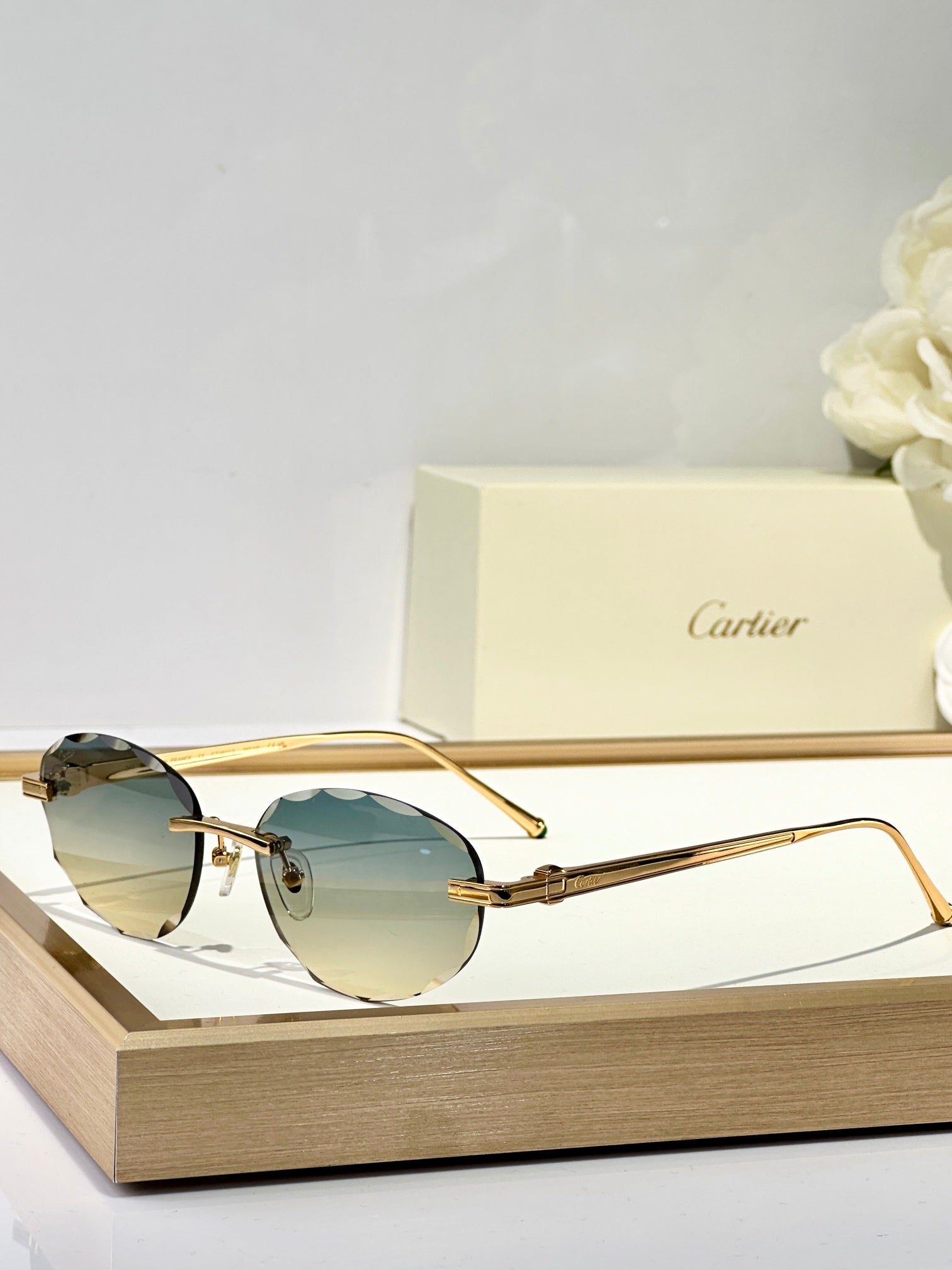 C DE RIMLESS ROUND FRAME SUNGLASSES CT0611S IN METAL