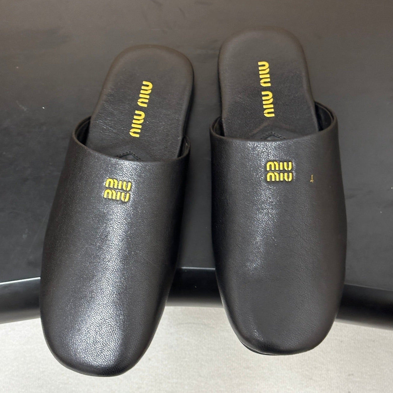Miu Miu 2026 Flat Closed-Toe Mule Black Cowhide 994104