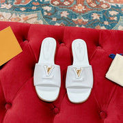 lv capri flat mule white calfskin