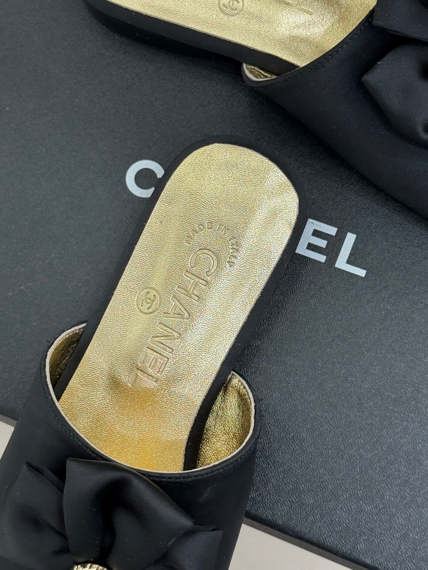 CC 26 Bow Flat Sandal Black Gold Satin Sheepskin 609799